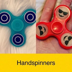 2 Handspinners - 1 Red emoji glow in the dark & 1 blue glow in the dark